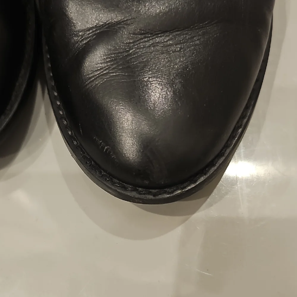 Stuart Weitzman Black Leather Slip-On Loafers